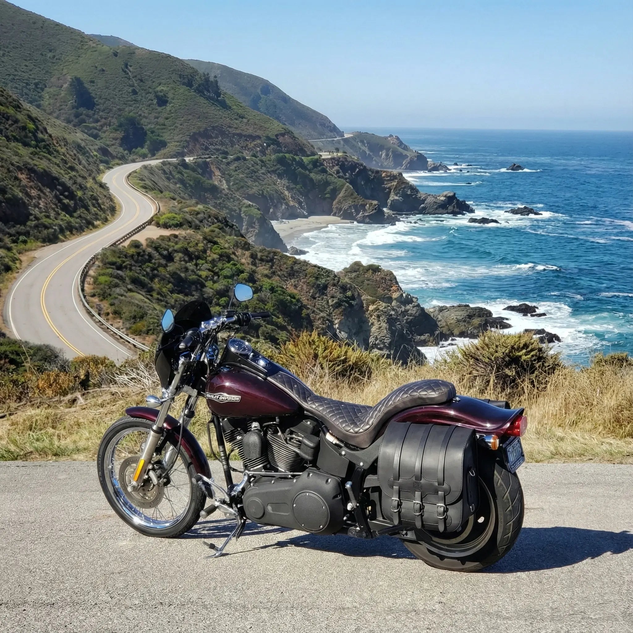 Motorcycle parked on a scenic road with ocean view